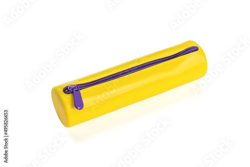Fototapeta Yellow pencil case with purple lock isolated on a white background