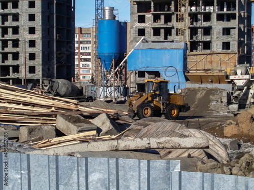 Buildings under construction. Residential buildings. Cranes and buildings. New residential area. Construction site. Concrete frame. Construction engineering. Ust-Kamenogorsk (kazakhstan)