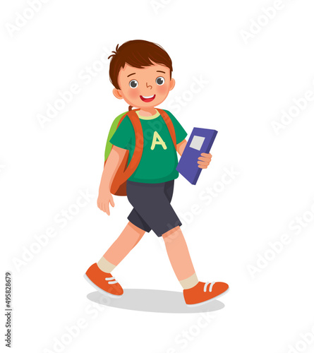 cute little school boy with backpack holding books walking to school 