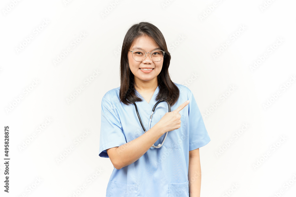 Showing Product and Pointing Side Of Asian Young Doctor Isolated On White Background Showing Product and Pointing Side Of Asian Young Doctor Isolated On White Background