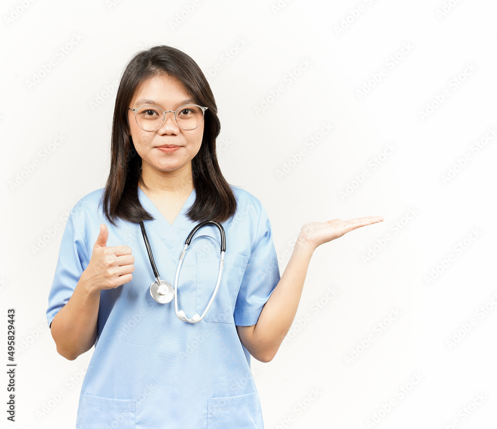 Showing and Presenting Product on Open Palm Of Asian Young Doctor Isolated On White Background Showing and Presenting Product on Open Palm Of Asian Young Doctor Isolated On White Background