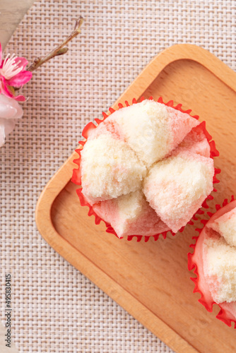 Cute Chinese steamed sponge cake - Fa Gao on wooden table background for spring festival celebration food. photo