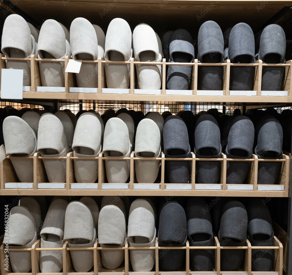Fabric slippers on shelves in clothes store. Fabric slippers on shelves in clothes store.