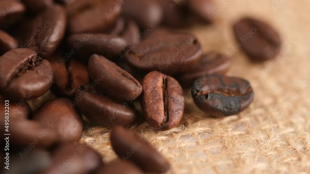 Coffee beans on canvas, close up. Rotation. 4K Coffee beans on canvas, close up. Rotation. 4K