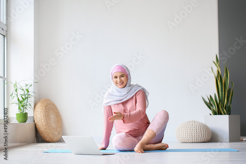 Young pregnant Muslim woman...