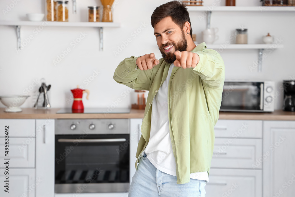 Handsome man dancing in kitchen Handsome man dancing in kitchen