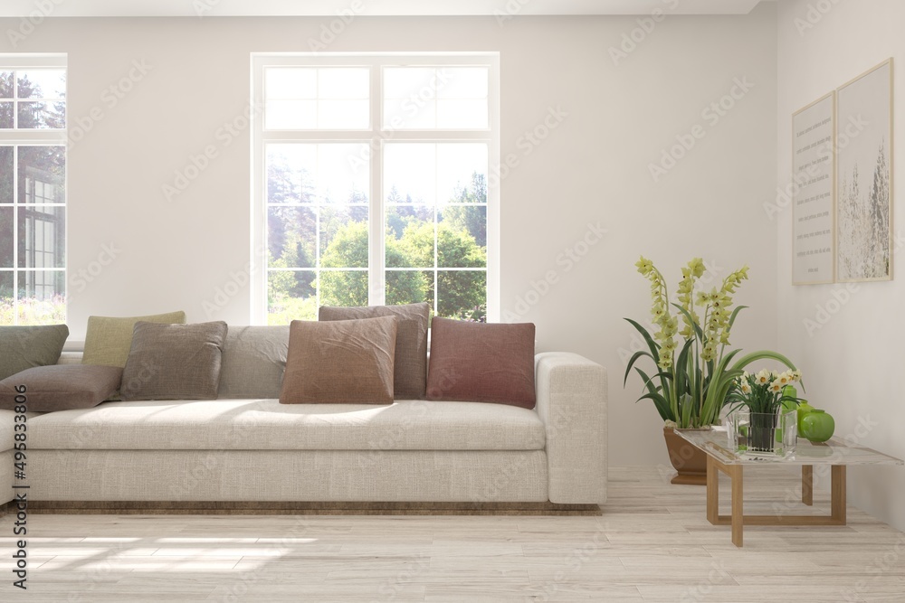 Fototapeta premium White living room with sofa and summer landscape in window. Scandinavian interior design. 3D illustration