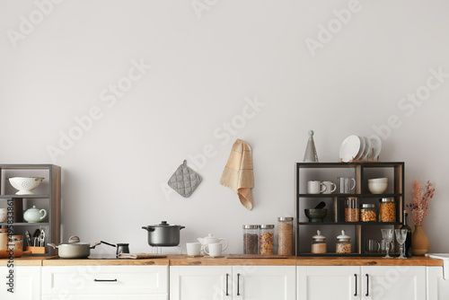 White counters with shelvin...