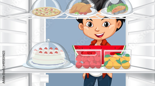 Boy looking at food in fridge