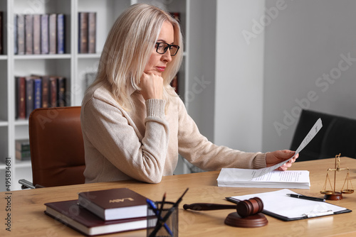 Mature female judge working...
