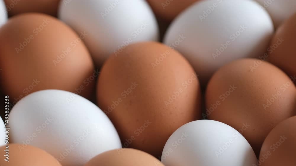 Chicken egg, rotation shot, Chicken fresh raw eggs.Healthy fresh food ingredients for breakfast. Animal products. Grocery. Chicken farm fresh eggs Chicken egg, rotation shot, Chicken fresh raw eggs.Healthy fresh food ingredients for breakfast. Animal products. Grocery. Chicken farm fresh eggs