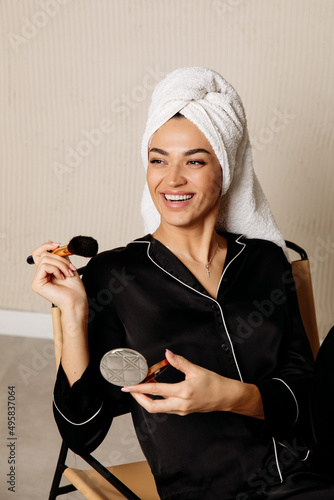 Woman with makeup brush