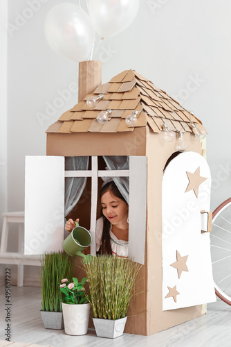 Funny little girl playing w...