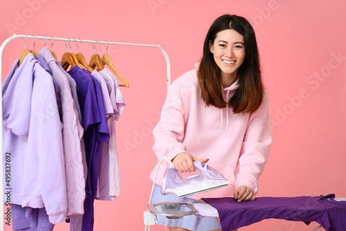 Young Asian woman ironing p...