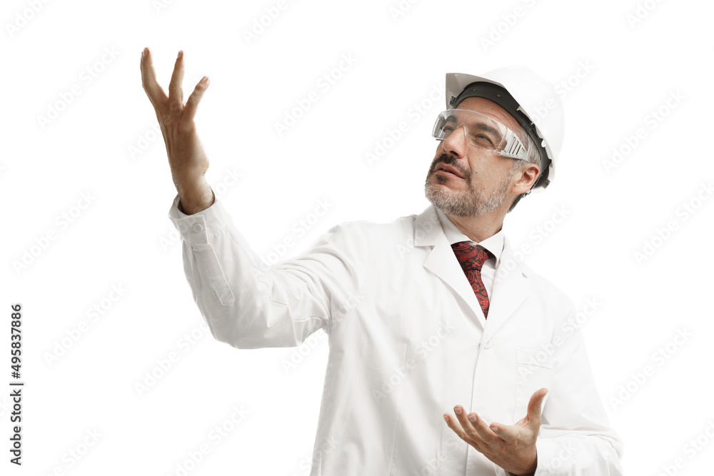 Caucasian middle age man wearing protective eye glasses and hardhat with white gown suit raised his right arm to the empty space. Caucasian middle age man wearing protective eye glasses and hardhat with white gown suit raised his right arm to the empty space.