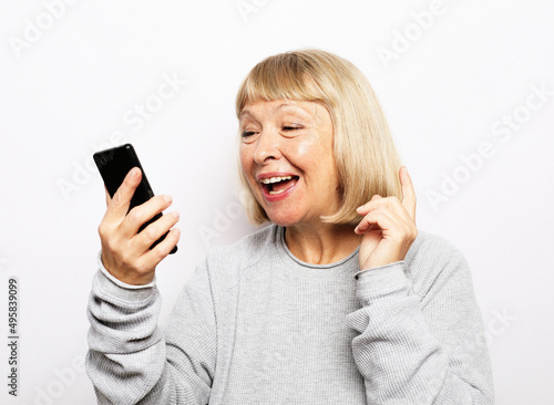 Portrait of her she nice attractive lovely pretty fashionable cheerful cheery grey-haired woman taking making selfie