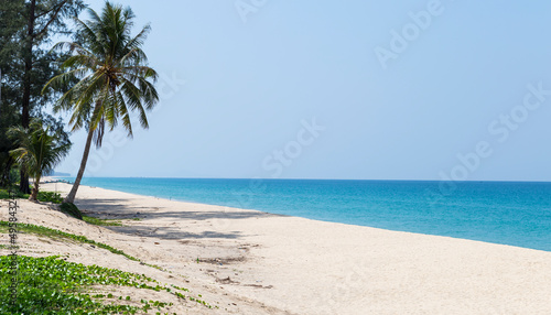 White sandy beach with blue sea background, summer beach, tropical island, vacation destination to south of Thailand