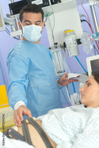 gynecologist doctor examining pregnant female patient