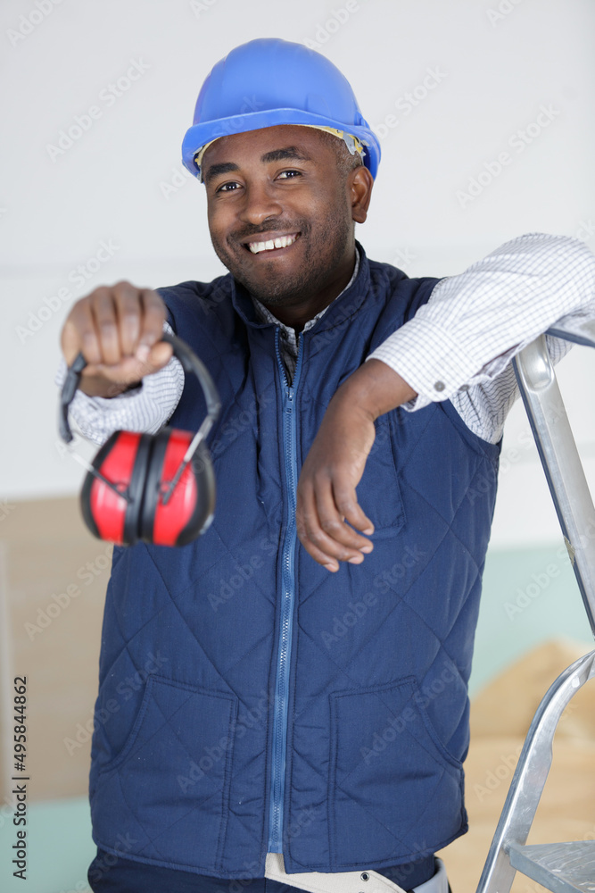 workman protecting his ears