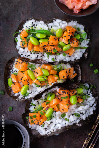 Vegan Sushi Tacos with Plant based salmon, wakame and edamame photo