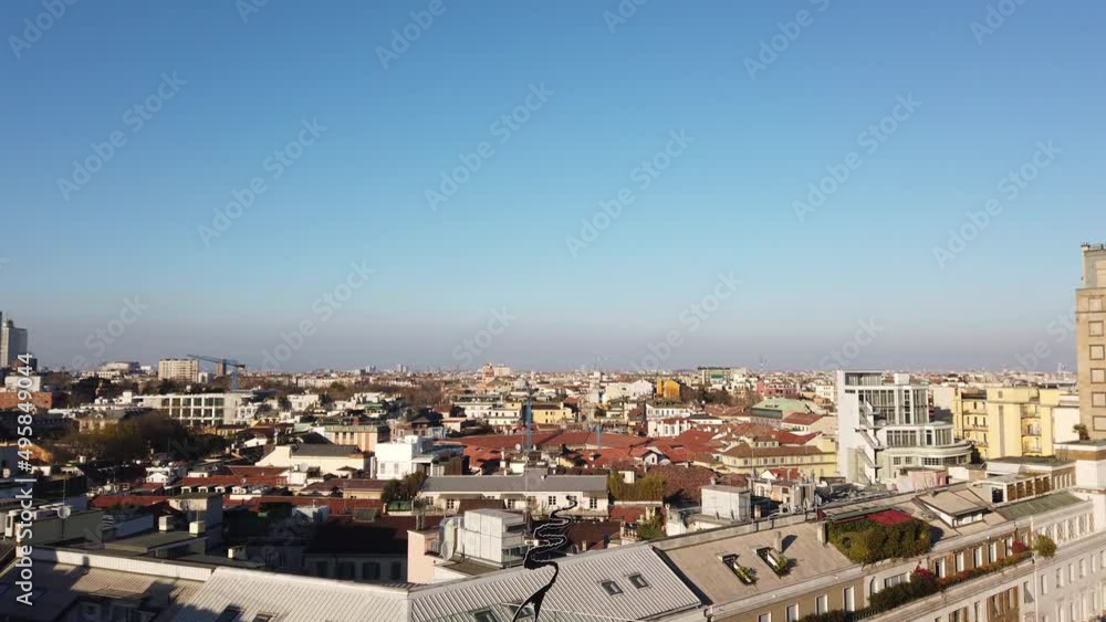 long panoramic wide shot of Milan old buildings in contrast with background technological citylife area long panoramic wide shot of Milan old buildings in contrast with background technological citylife area