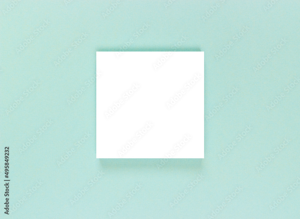 white sheet of paper on a blue textured background