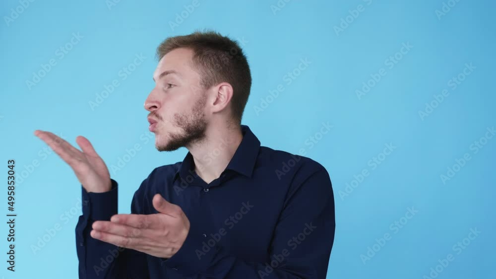 Air kiss. Sending love. Affection sympathy. Boomerang motion. Cute cheerful man with romantic expression blowing smooch isolated on blue background GIF loop animation. Air kiss. Sending love. Affection sympathy. Boomerang motion. Cute cheerful man with romantic expression blowing smooch isolated on blue background GIF loop animation.