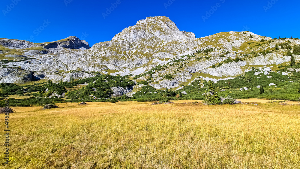 Fototapeta premium Panoramic view on the mountain peaks of the Hochschwab Region in Upper Styria, Austria. Sharp summits of Seemauer, Polster, Oehler in the Alps in Europe. Climbing, Wilderness. Concept freedom