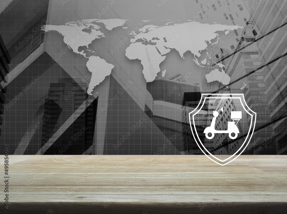 Motorcycle with shield flat icon on wooden table over black and white world map, modern city tower and skyscraper, Business motorbike insurance concept, Elements of this image furnished by NASA