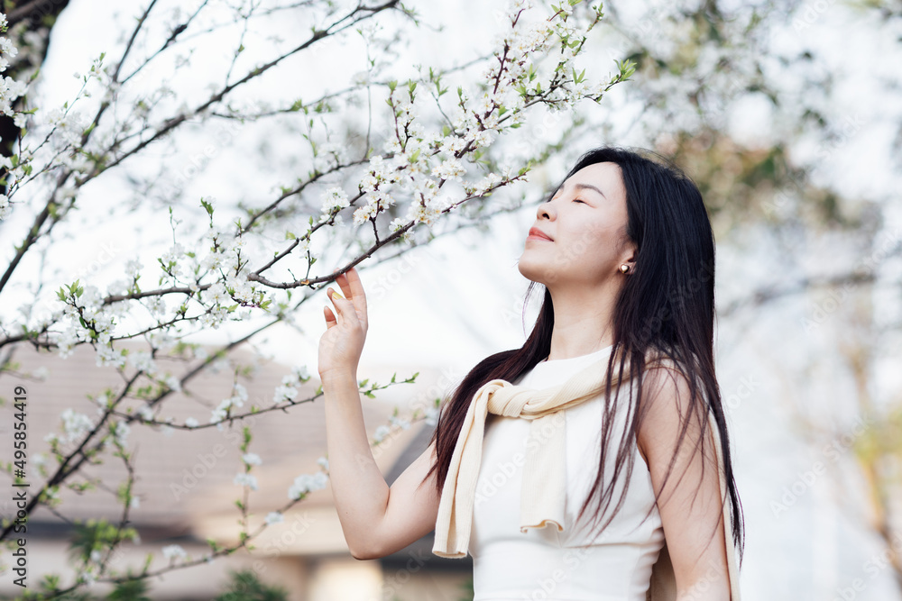 Candid lifestyle Portrait of happy young beautiful asian sexy woman enjoying life outdoor in park at spring. Smiling millennial girl with perfect clear glow skin and long brunette hair Candid lifestyle Portrait of happy young beautiful asian sexy woman enjoying life outdoor in park at spring. Smiling millennial girl with perfect clear glow skin and long brunette hair