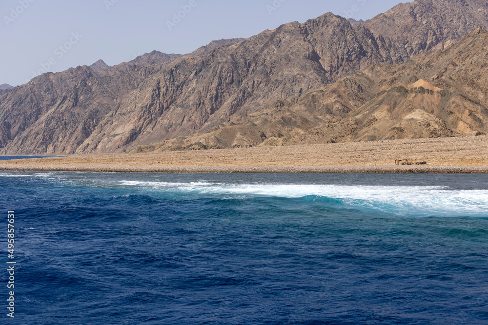 The Red Sea on the Gulf of Aqaba, surrounded by the mountains of the Sinai Peninsula, Dahab, Egypt