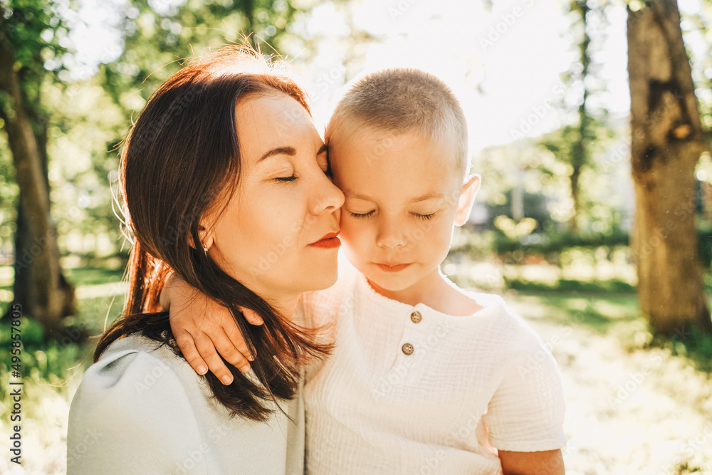 Mother and little son portrait in park. Mother and little son portrait in park.