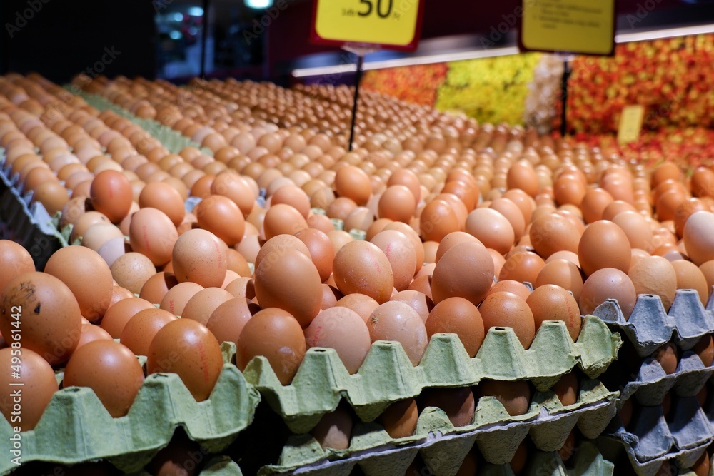 hen eggs in egg cups with price tags in a large food market in Budapest, Hungary