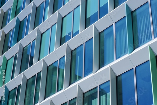 modern office building detail with square blue green windows