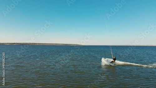aerial view active man kiteboarding and windsurfing in slow motion, active lifestyle extreme sport concept