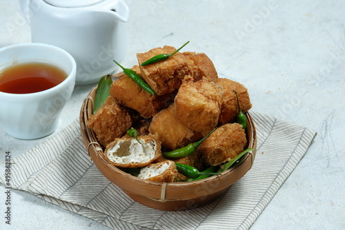 tahu gejrot , is a typical food from Cirebon, Indonesia.Traditional street food dish of fried bean curd with crushed shallot and green chili in sweet soy sauce photo