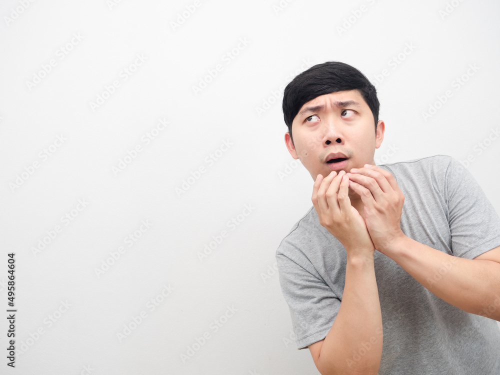 Asian man gesture excited looking at coy space white background Asian man gesture excited looking at coy space white background