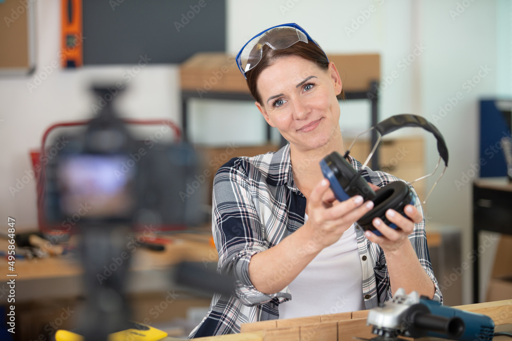 young female repairman recording video for her blog young female repairman recording video for her blog