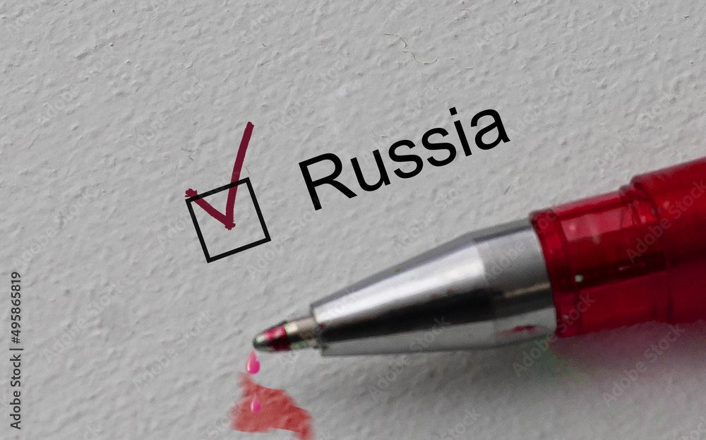 Fototapeta premium check mark on the word russia and red pen. Closeup, concept