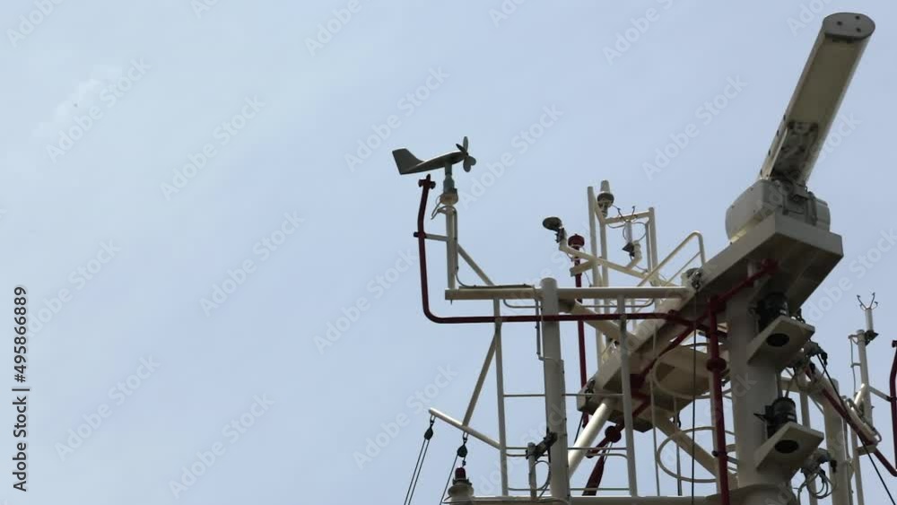Weather vane and radar on the ship's mast. Weather vane and radar on the ship's mast.