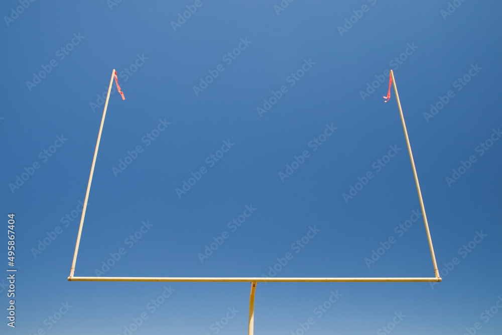 The upright silhouette of the scoring area of Football field goal posts