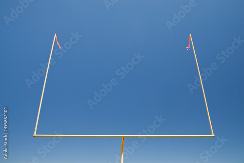 The upright silhouette of the scoring area of Football field goal posts, on a sports field 