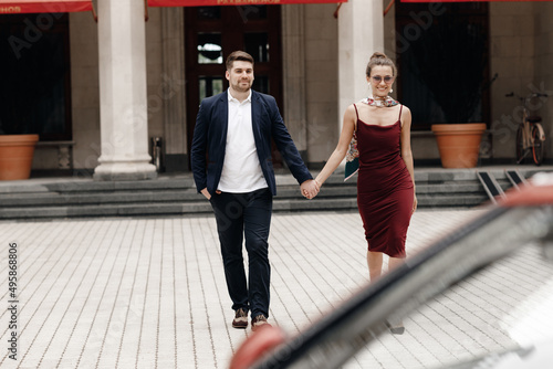 Fashion couple of man and woman with cabrio car