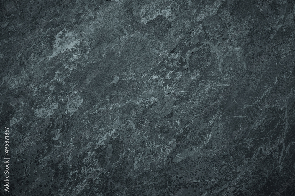 Worn granite stone background with scratched stained texture