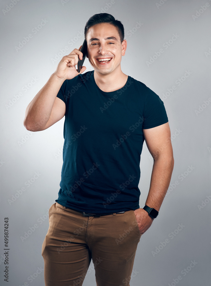 Speak with confidence and youll always be charming. Studio shot of a handsome young man on call against a grey background. Speak with confidence and youll always be charming. Studio shot of a handsome young man on call against a grey background.
