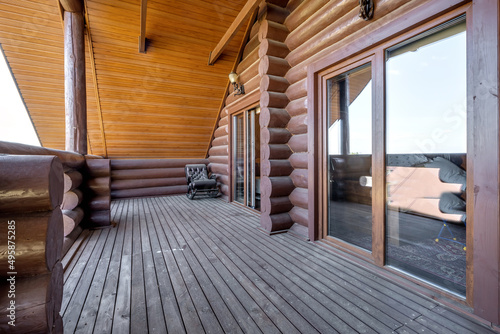 wooden doors to a country house in the form of a log house