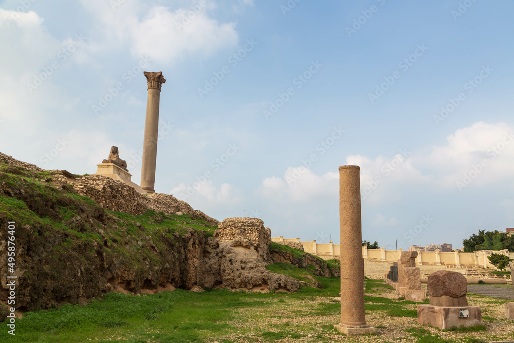 Pompey's pillar and ancient sphinx statue roman triumphal column in Alexandria, Egypt