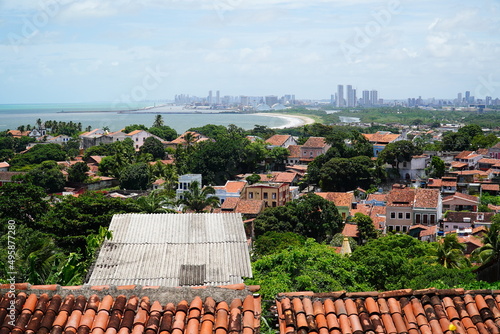 Panoramic view of historical city of Olinda, UNESCO World Heritage Site. In background high rise buildings of the capital of state Pernambuco, Brazil. photo