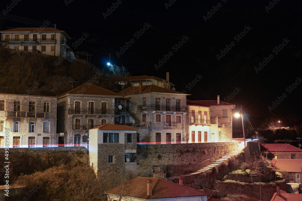 Greek village with traditional stone built houses night view.
