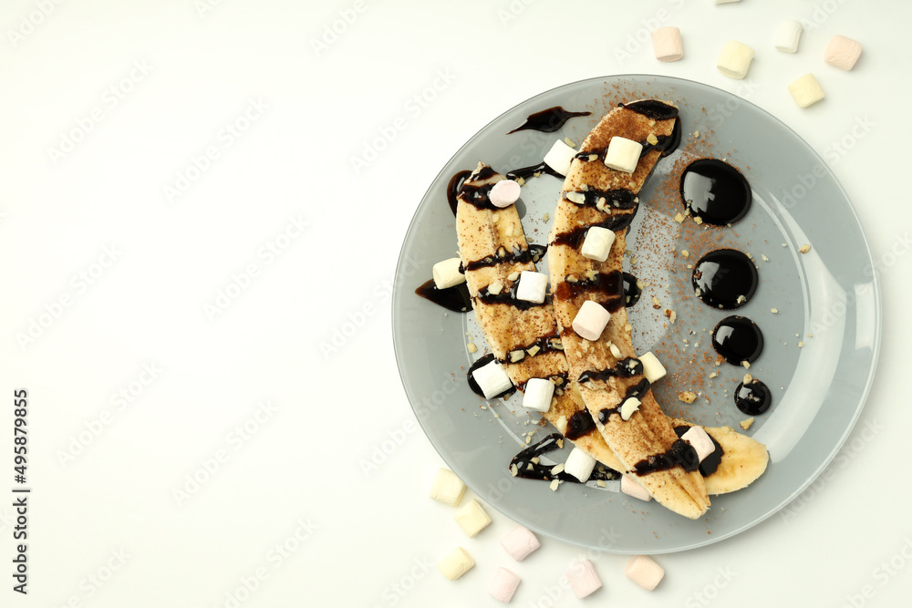 Concept of tasty food with banana dessert on white background Concept of tasty food with banana dessert on white background